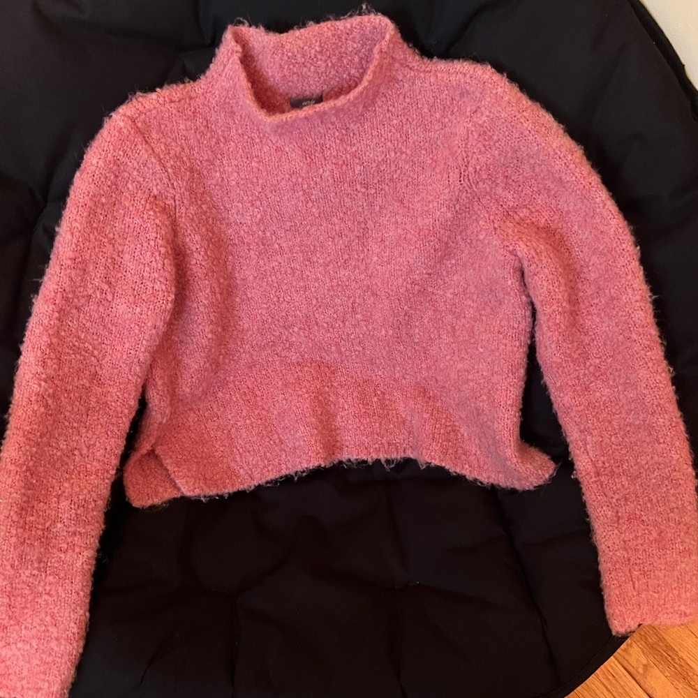 Assorted sweaters ranging from crop to open cardigan